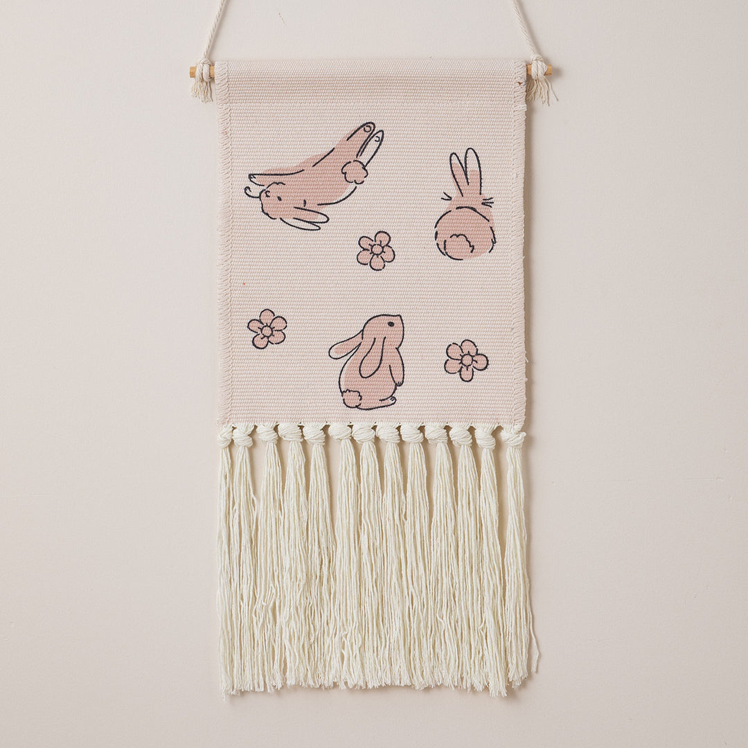 Woven wall hanging with hand-knotted fringes and bunny motif