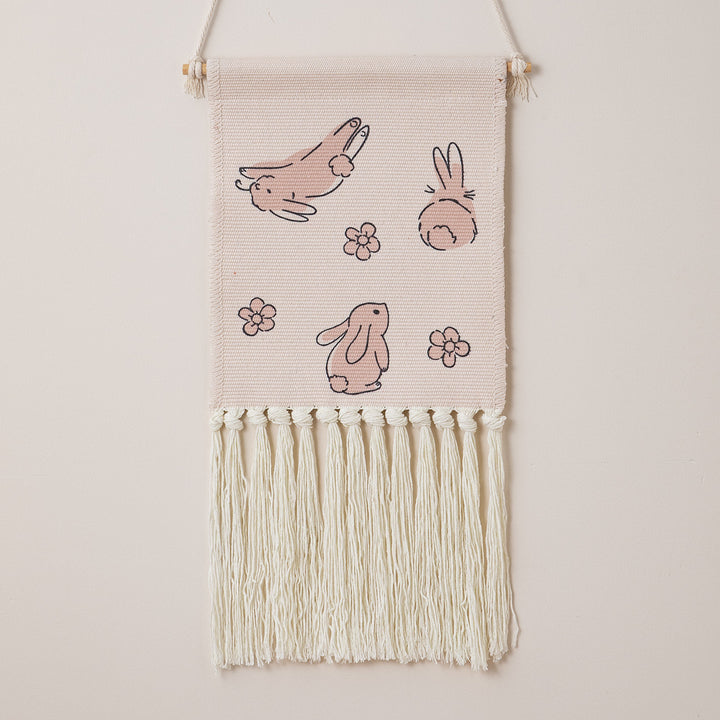 Woven wall hanging with hand-knotted fringes and bunny motif