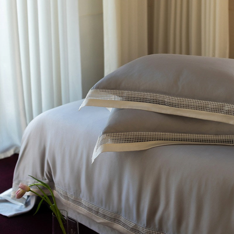 Elegant bedding set with lace grid trim and hotel closure