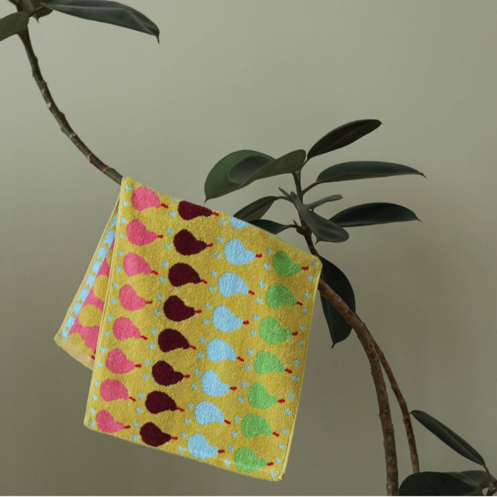 Jacquard guest towel made of cotton terry with playful bird and heart pattern