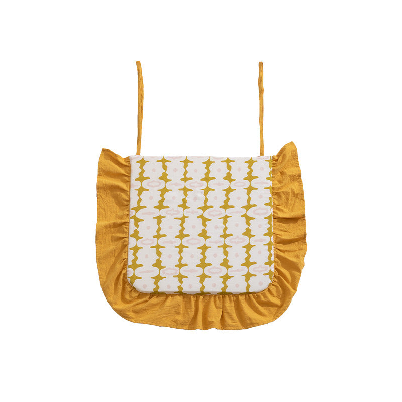 Padded chair cushion with ties, ruffled edge and embroidered hole pattern look Kalsten