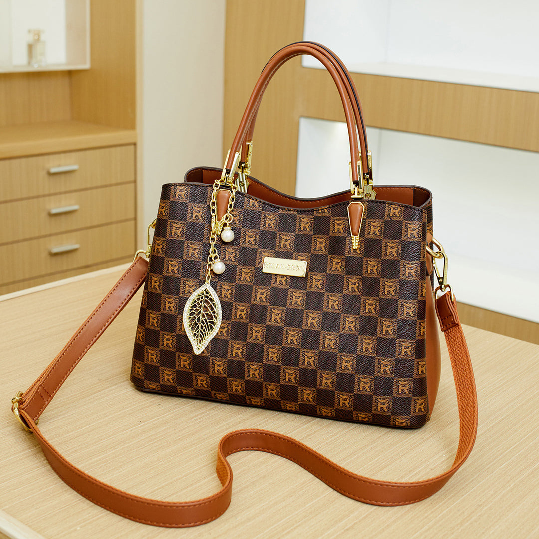 Elegant Designer Handbag with Decorative Charm