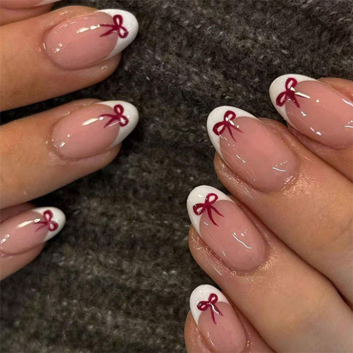 Artificial nail set with romantic bow motifs and French design Kalsten