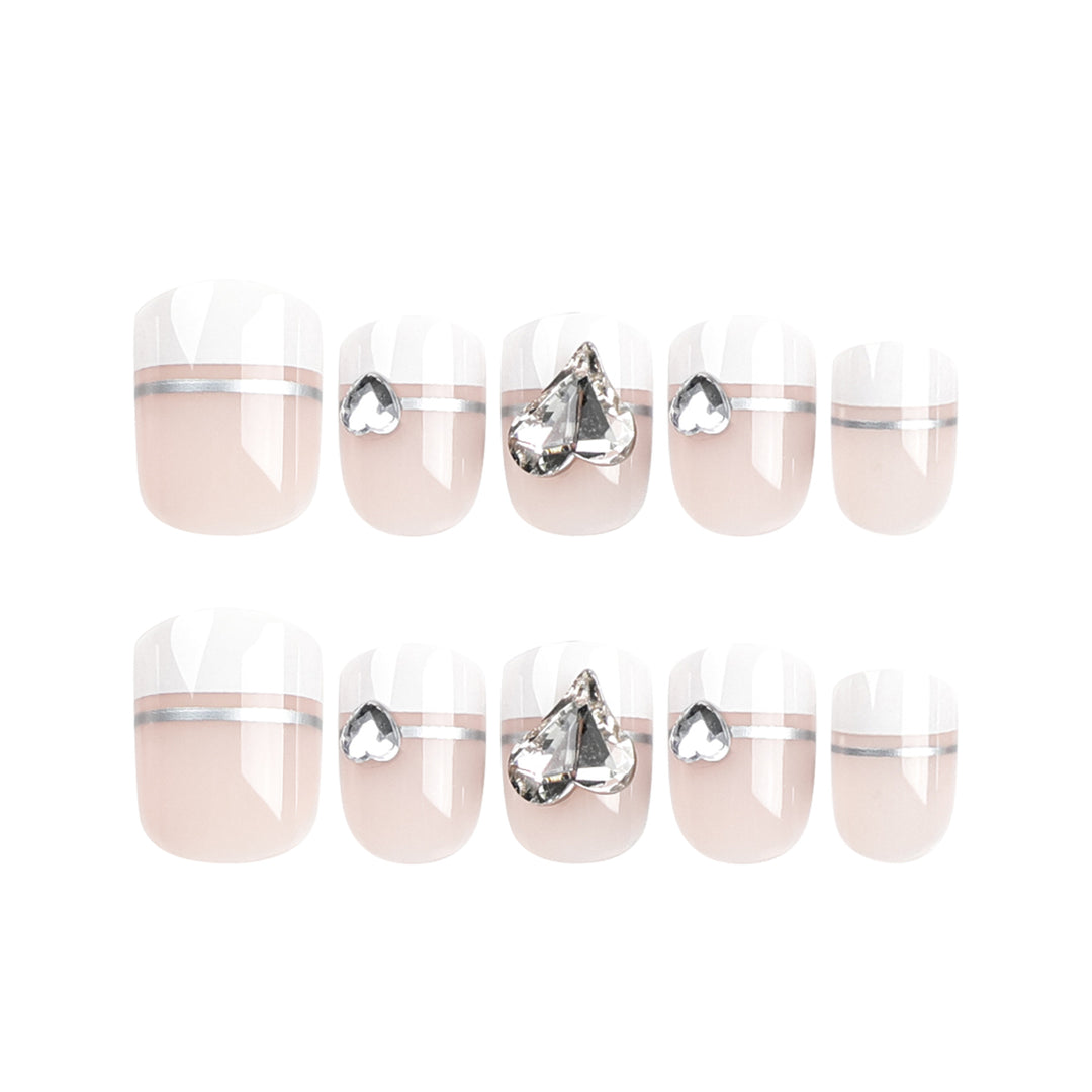 Elegant Nail Art with Glitter Accents and Jewelry Details Kalsten
