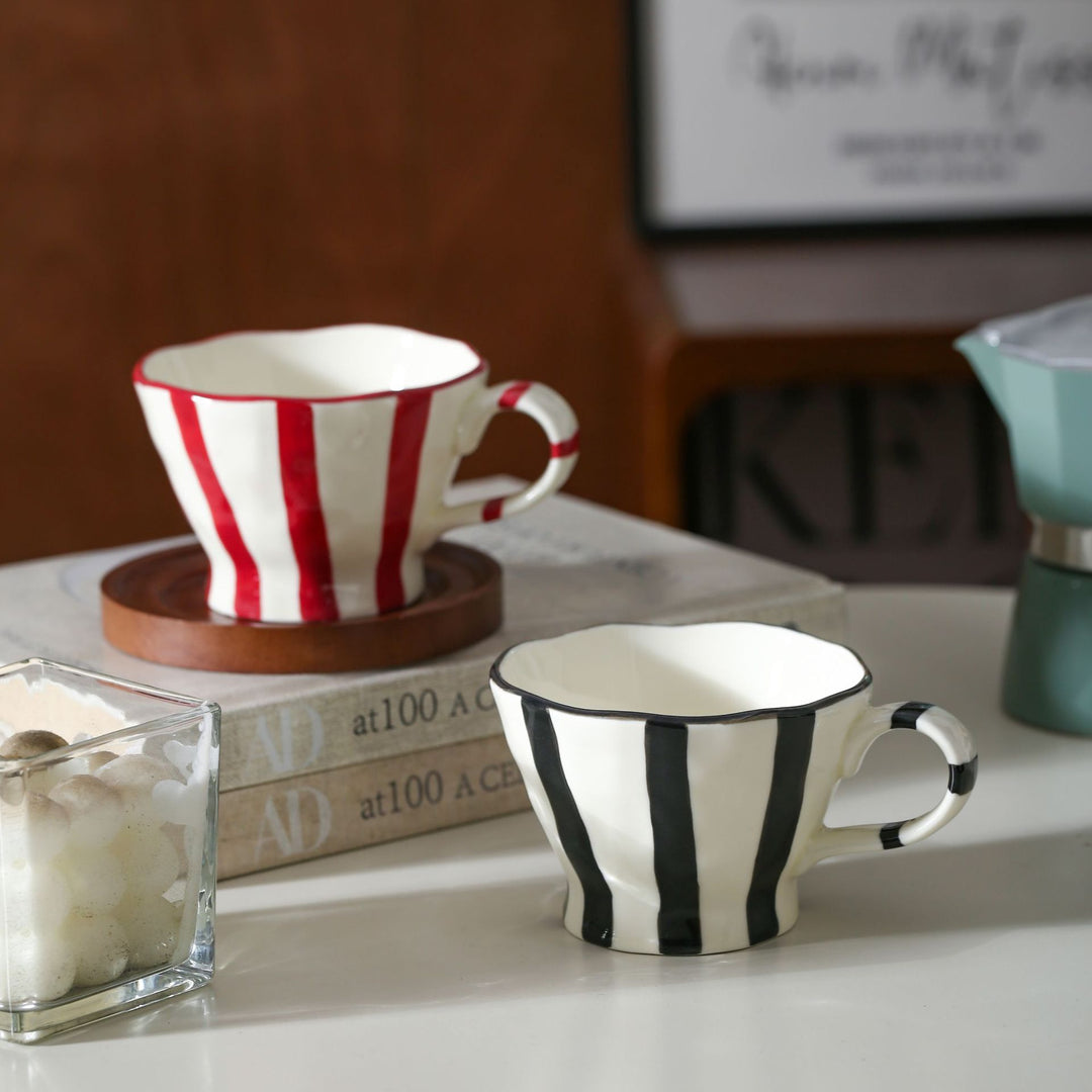 Designer stoneware coffee mug with scalloped rim and vertical brushstroke