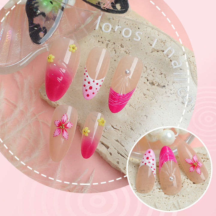 Artful nail tips with delicate floral embellishments Kalsten