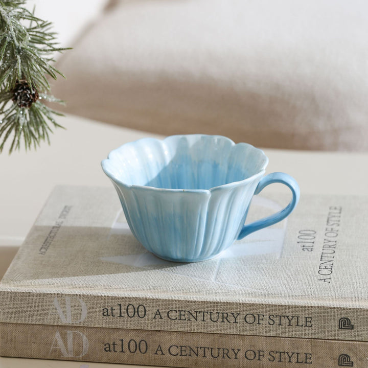 Ceramic mug with saucer in flower shape