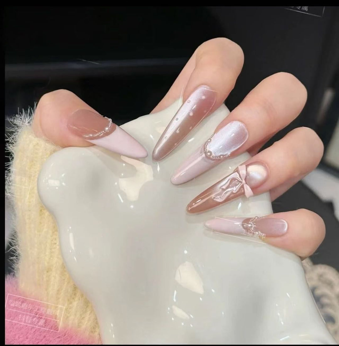 Acrylic nail set with elegant tips and glamorous rhinestone accents Kalsten