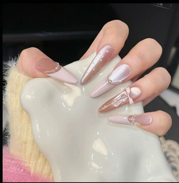 Acrylic nail set with elegant tips and glamorous rhinestone accents Kalsten
