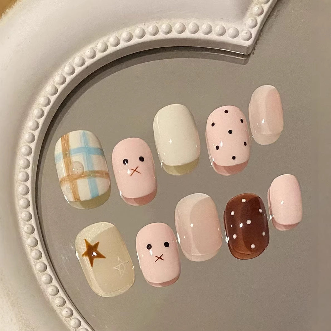 Artistic Press-On Nail Art Set with Whimsical Designs