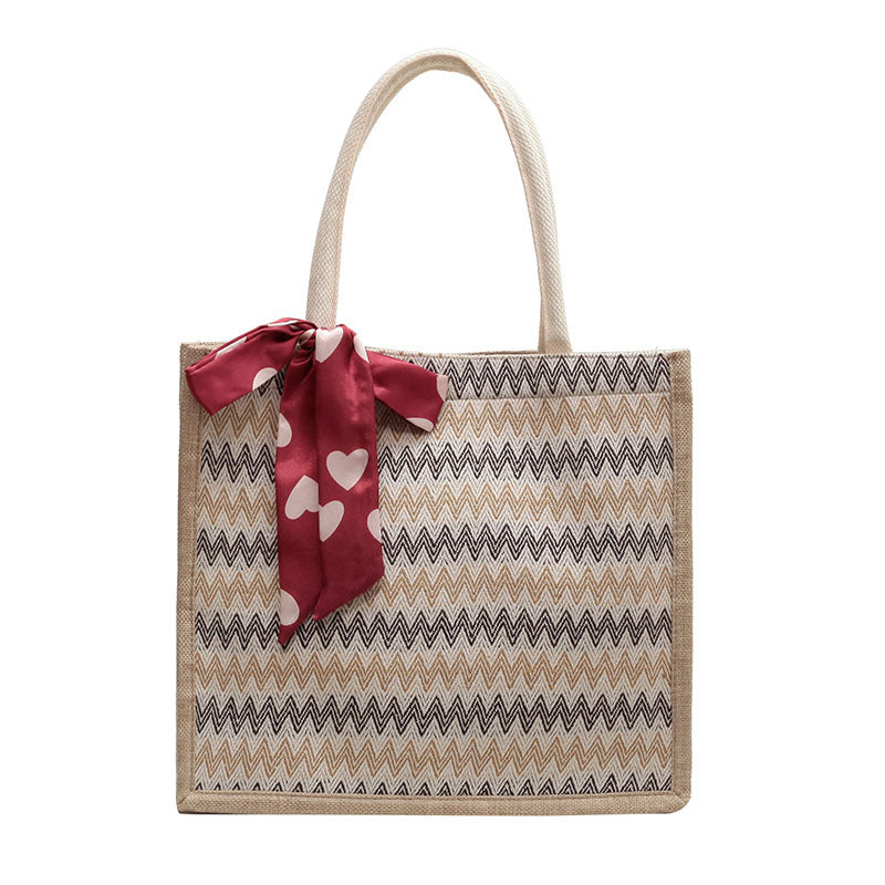 Textured Handbag with Decorative Bow