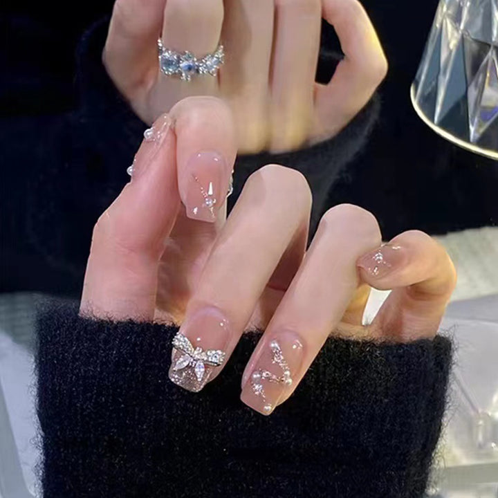 Artificial nails in an elegant design with 3D butterflies and glitter accents Kalsten