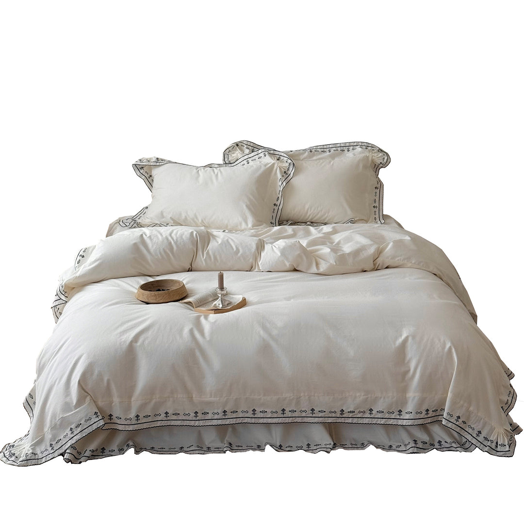 Luxurious embroidered bedding set with ruffled hem