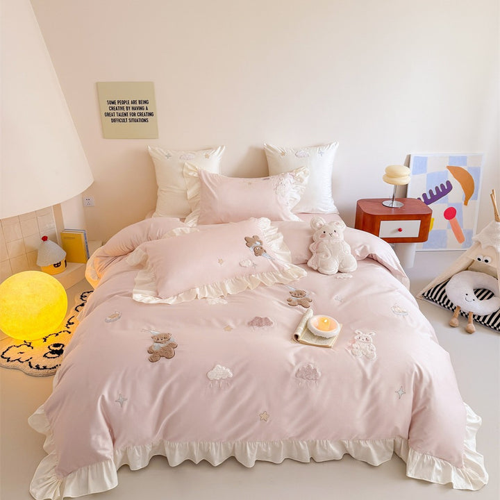Romantic ruffle bedding set with embroidered teddy bear and cloud appliqués