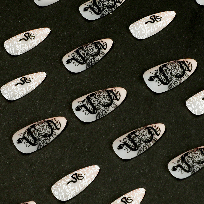 Artful nail extensions in elegant stiletto style with artistic floral and graphic designs Kalsten