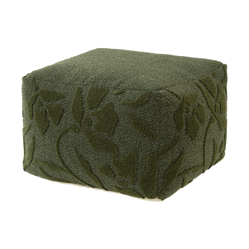 Square floor sitting pouf with textured bouclé surface and floral relief