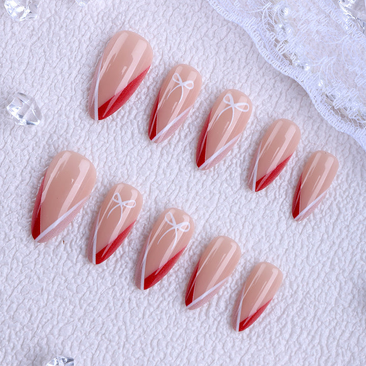 Artificial nails in elegant stiletto design with bow accents Kalsten