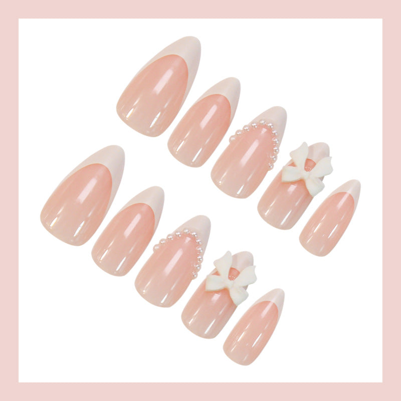Acrylic nail set with elegant floral embellishments and trendy French tip Kalsten
