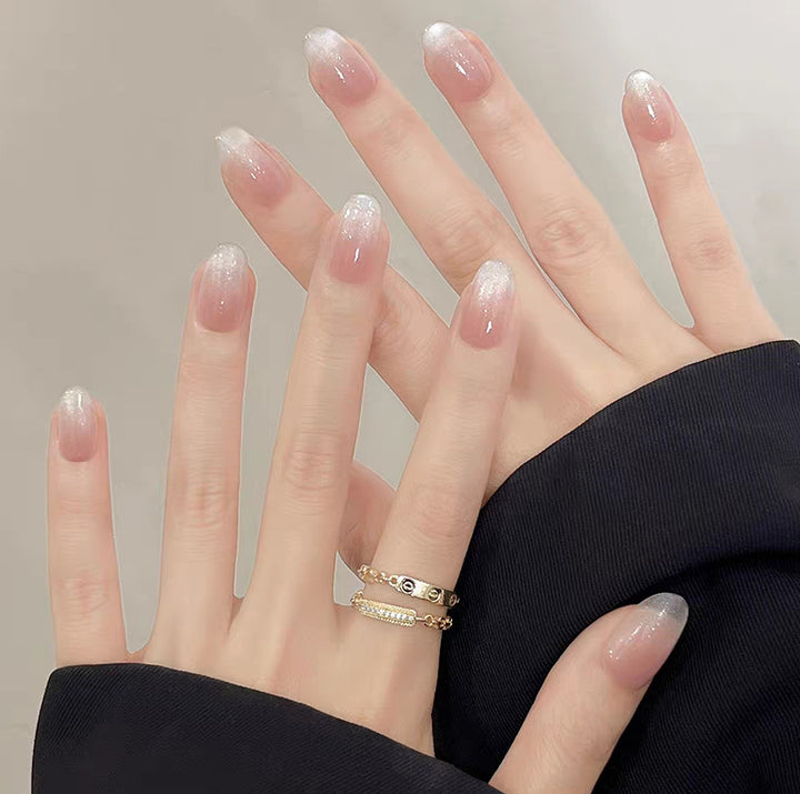 Artistic Press-On Nail Design with Floral and Glitter Accents Kalsten