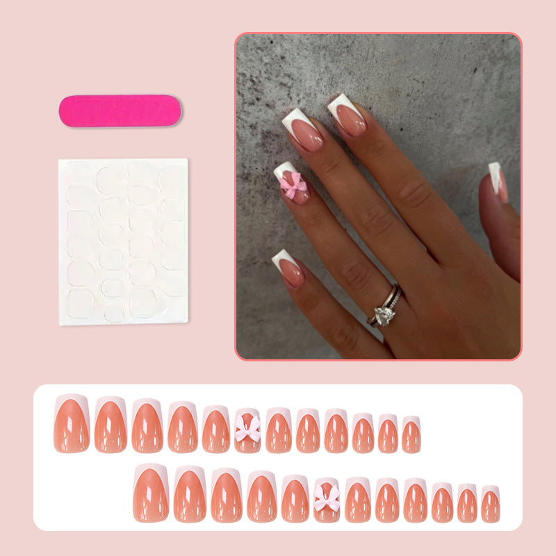 Acrylic nail set with elegant tips and playful bows Kalsten
