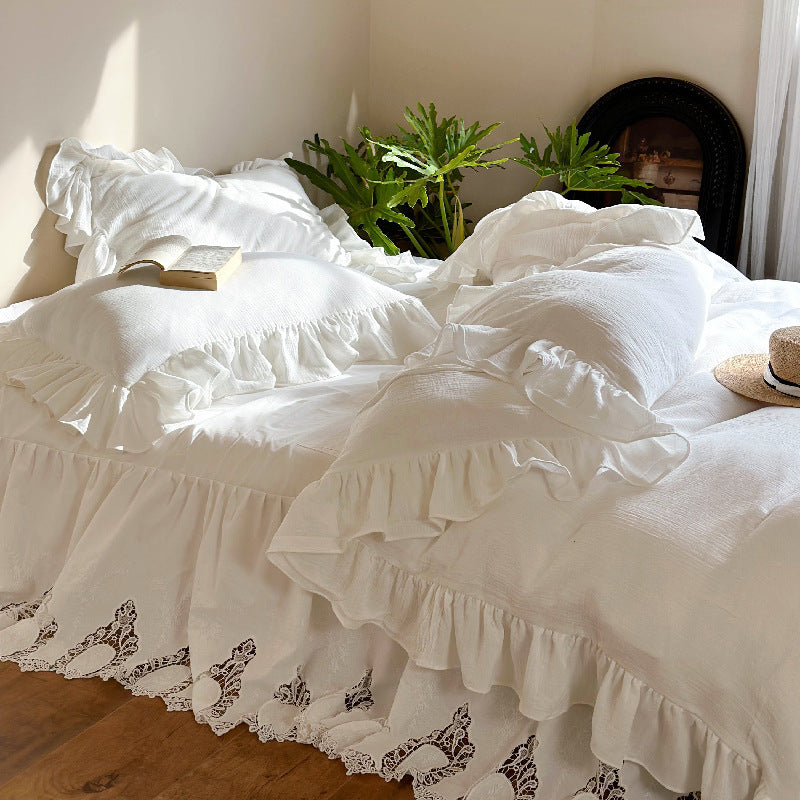 Romantic bedding set with voluminous ruffle, lace bed skirt, and double-layered frills