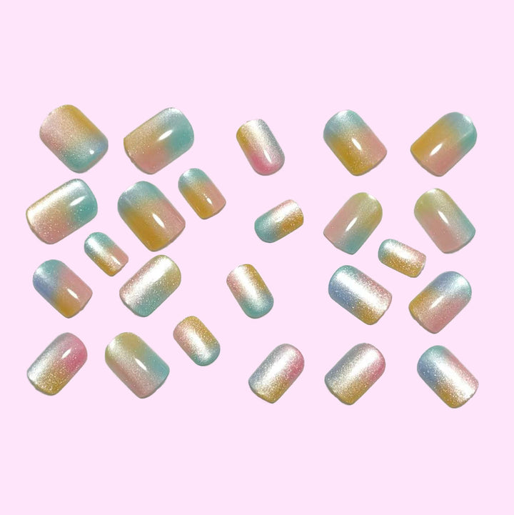 Artificial nails in delicate ombre design with glitter effects Kalsten
