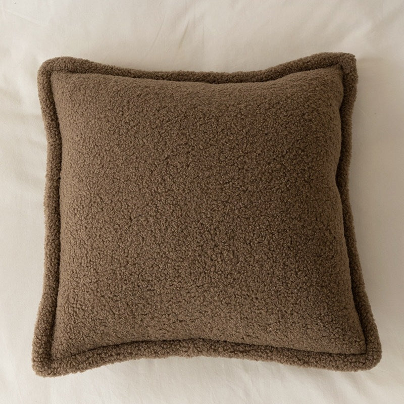 Decorative teddy fleece cushion with padded filling and piped seam
