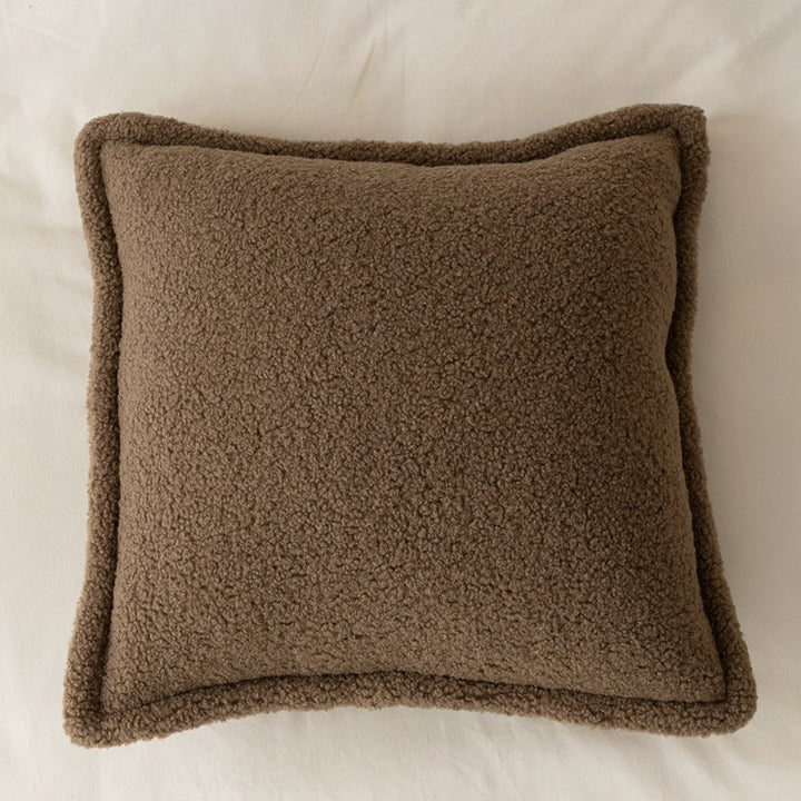 Decorative teddy fleece cushion with padded filling and piped seam
