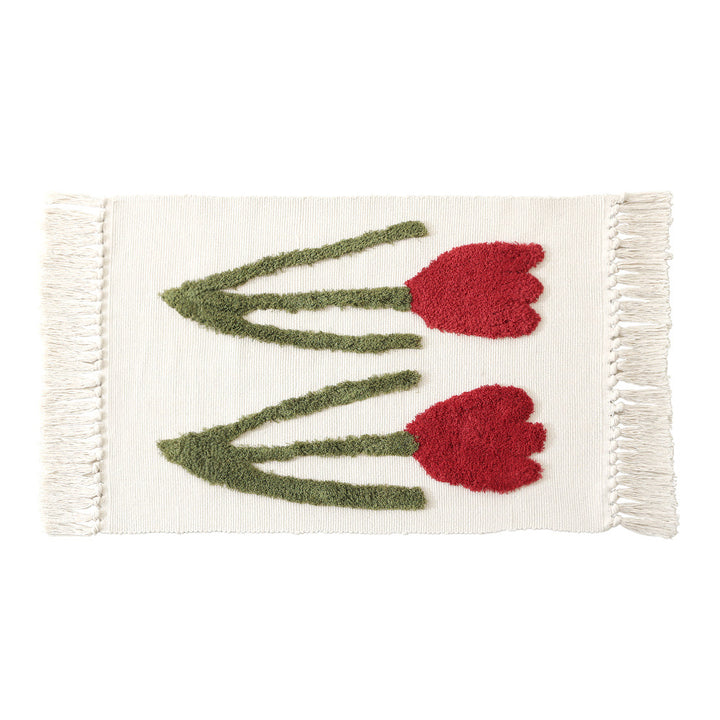 Handwoven cotton bath mat rug with tufted flower appliqué and tassels Kalsten