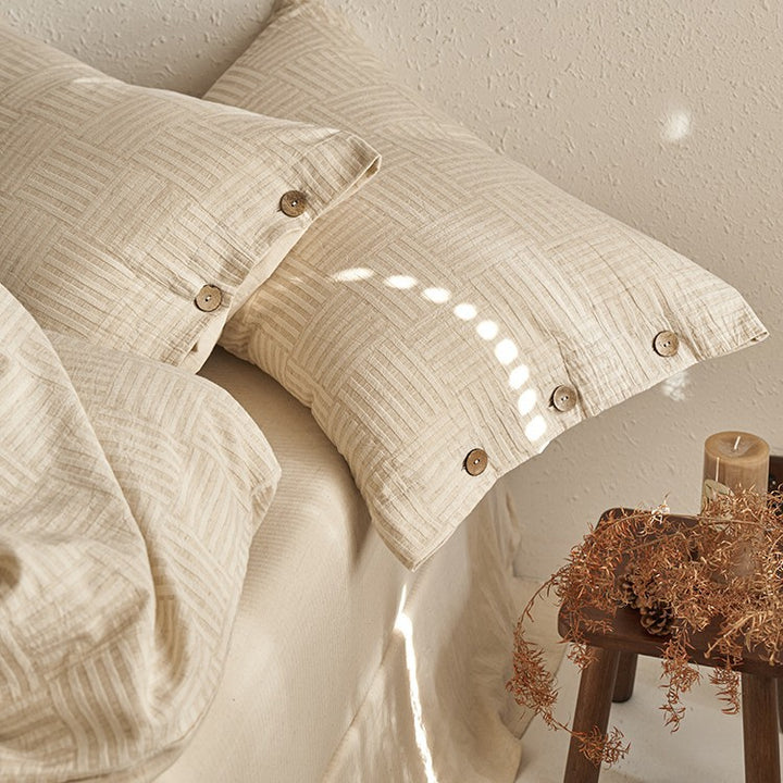 Linen-look bedding set with natural wood button closure and fine texture