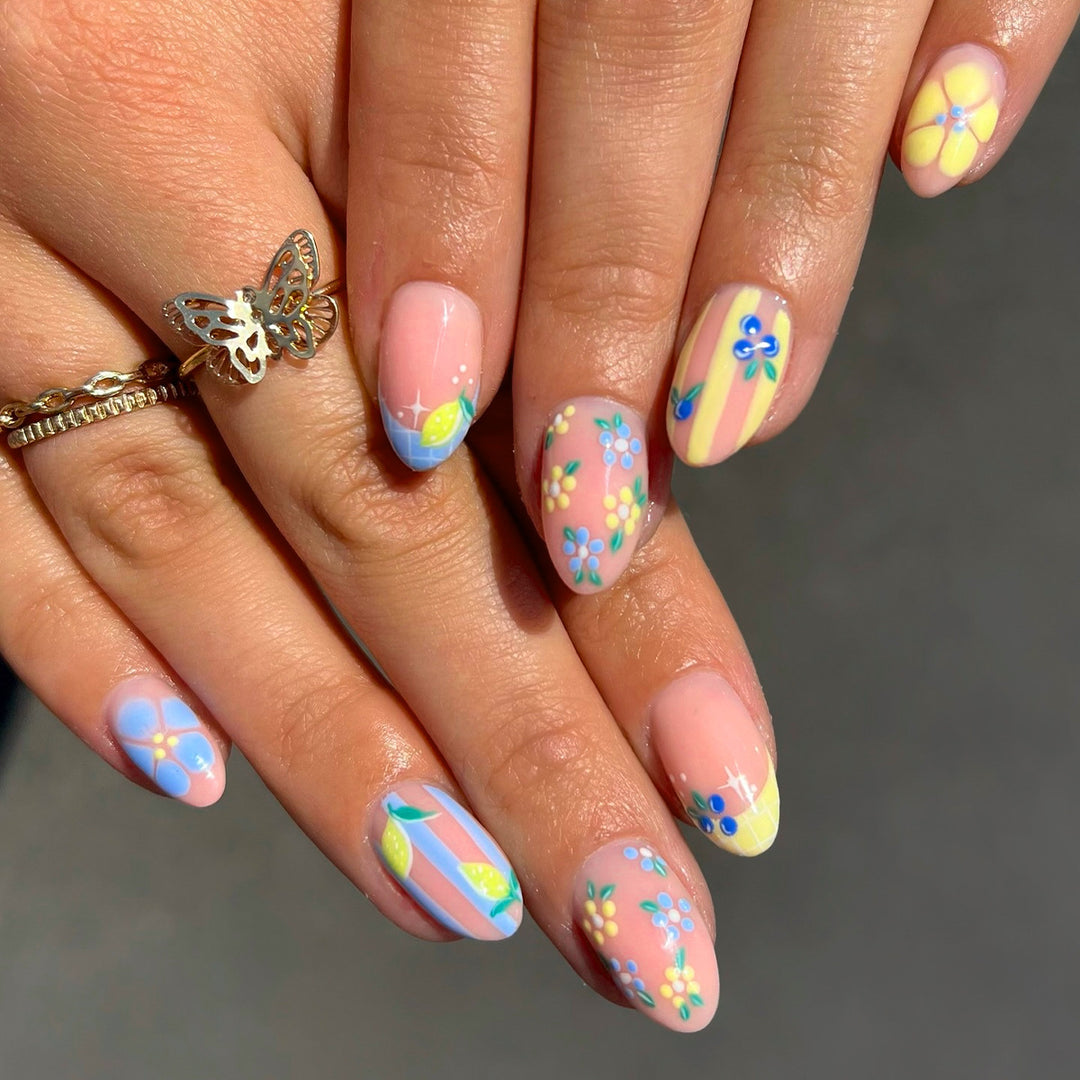 Artistic 3D nail art with cheerful floral designs Kalsten