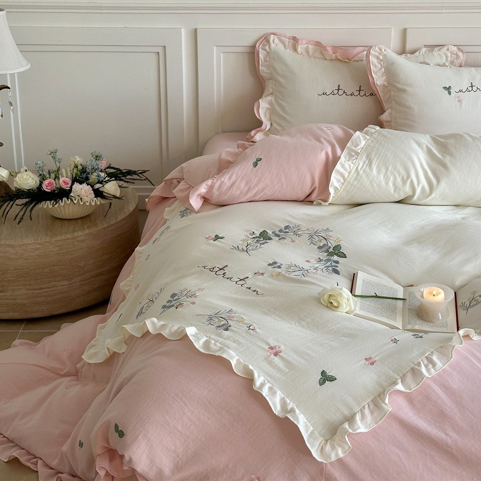 Bedding set with ruffles, embroidered middle cover and delicate flower application