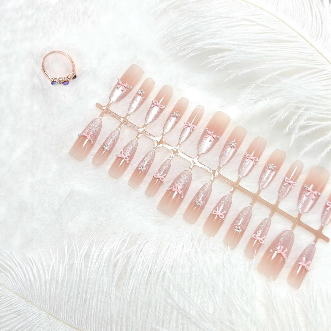 Artificial nails with elegant glitter and bow design Kalsten