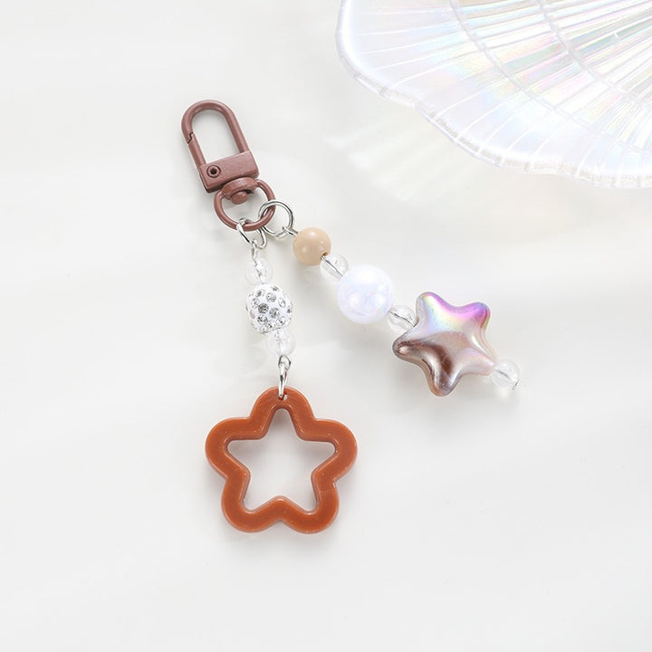 Playful keychain with floral and star motif Kalsten