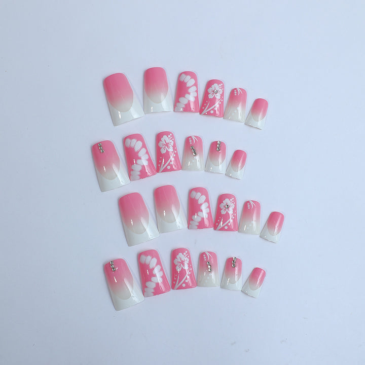 Acrylic nail set with elegant floral designs and glitter accents Kalsten