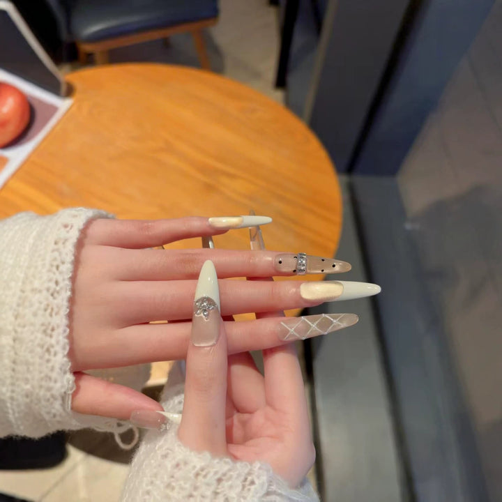 Elegant Stiletto Nail Extensions with Decorative Designs