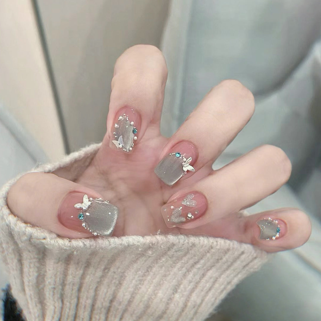 Artful artificial nails with elegant butterfly accents Kalsten