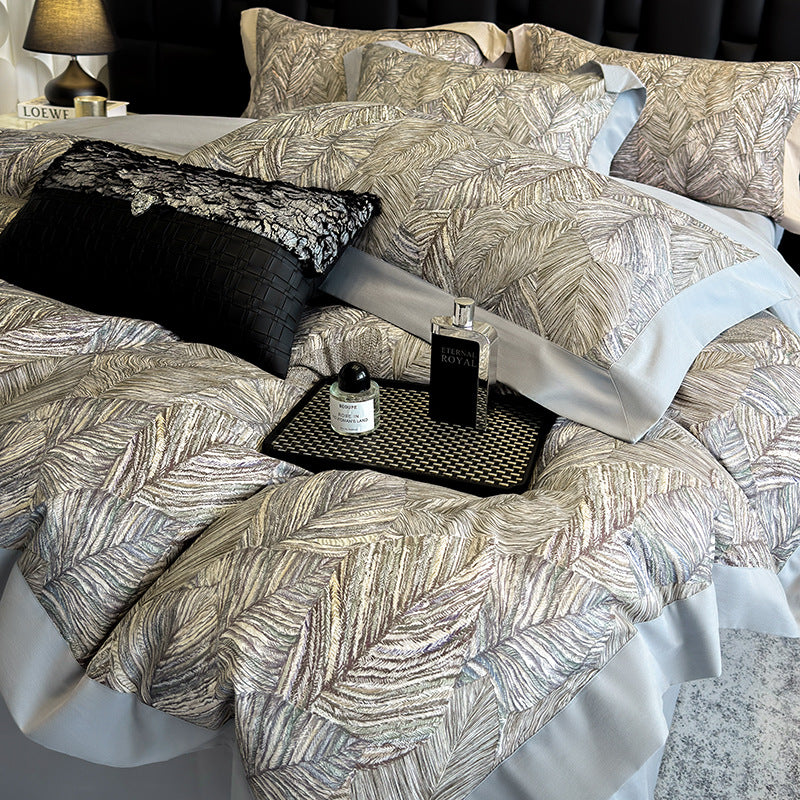 Elegant bed linen set made of cotton satin with a subtle leaf pattern and contrast piping