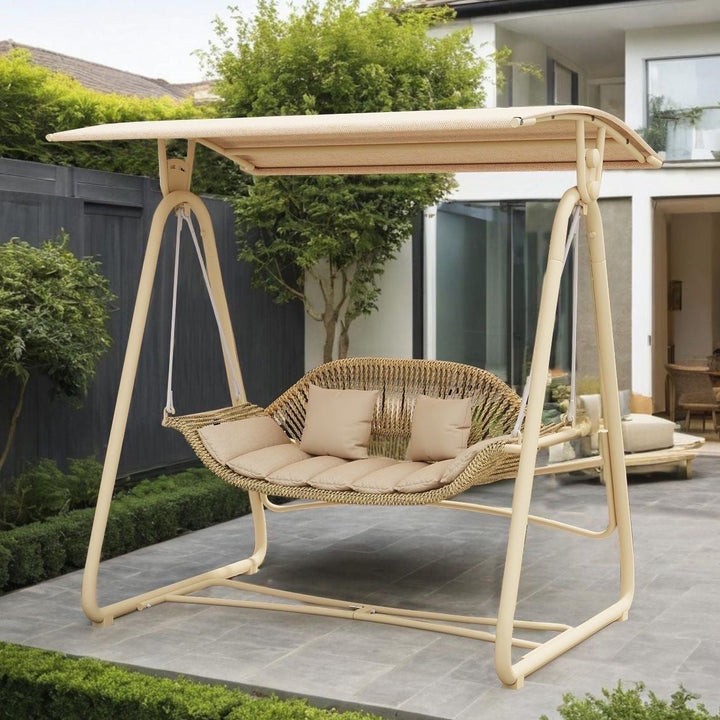 Woven rattan outdoor swing loveseat with padded cushions and powder-coated steel frame Kalsten