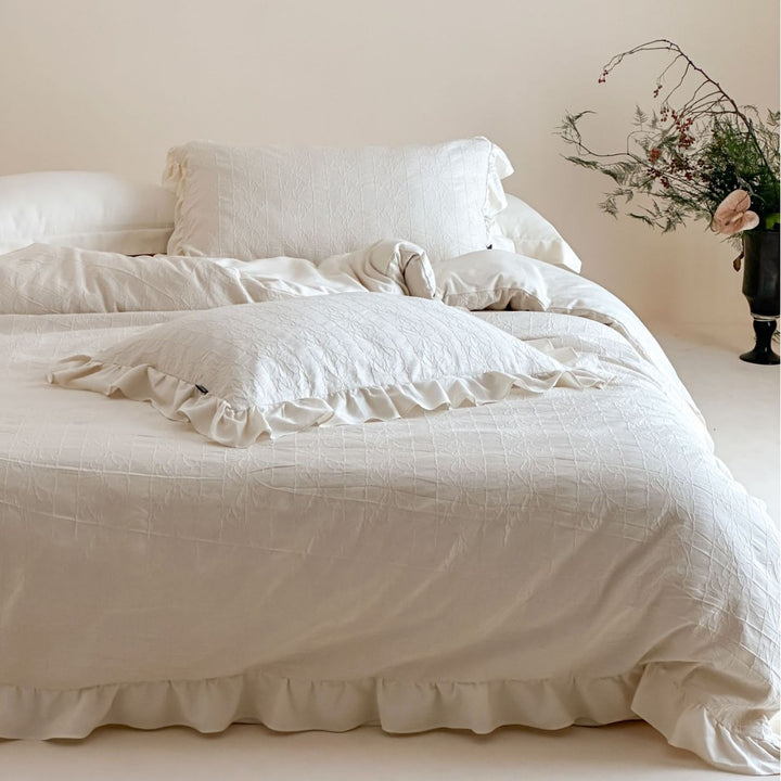 Quilted cotton-linen duvet cover set with subtle wrinkled texture and ruffle