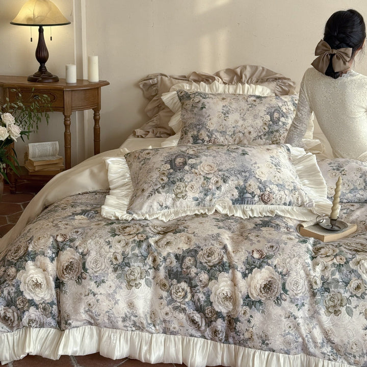 Romantic satin bedding set with floral jacquard look and gathered ruffle