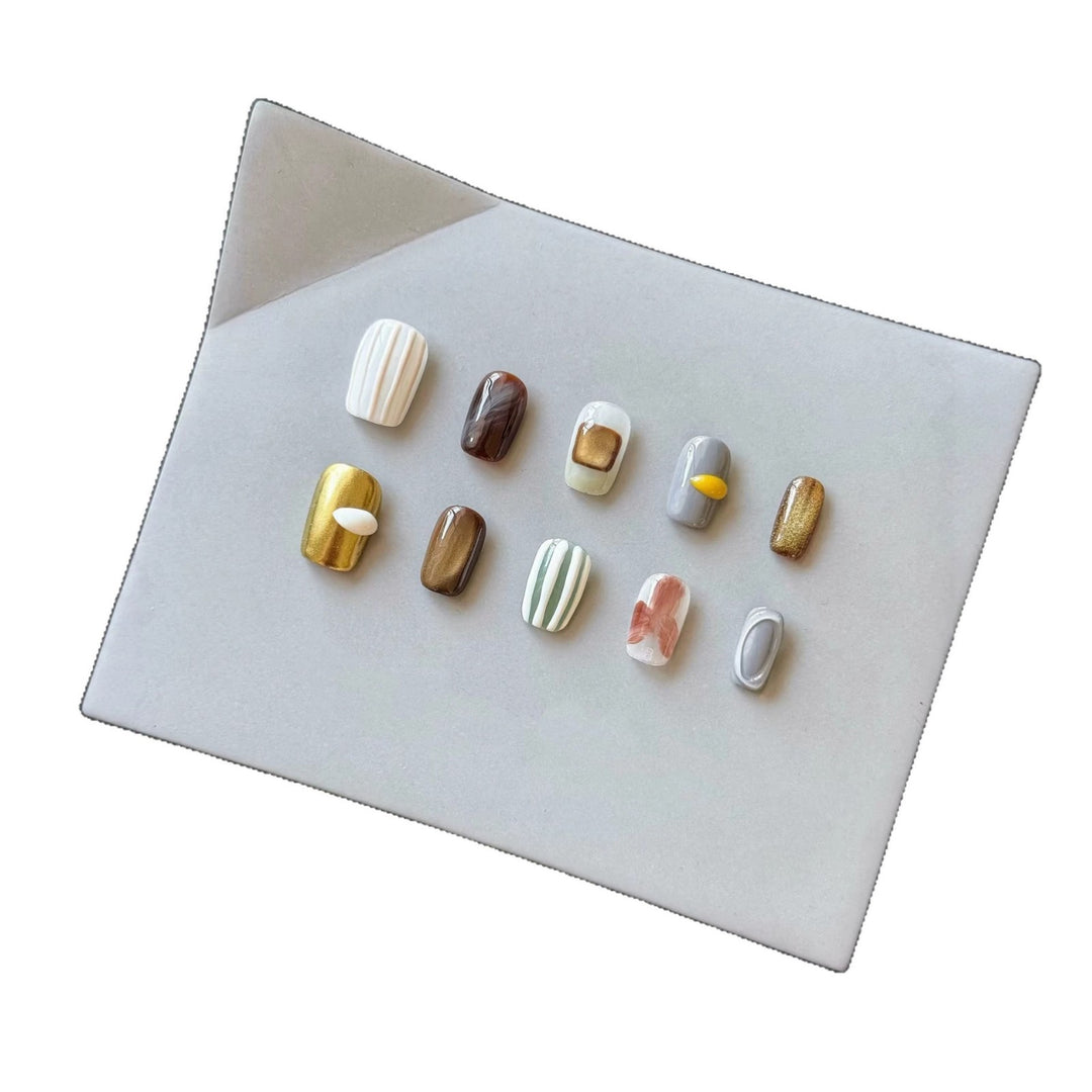 Artistic Press-On Nail Set with Unique Textured Designs