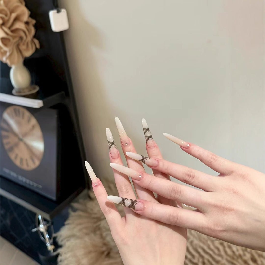 Elegant Stiletto Nail Enhancements with Artistic Accents