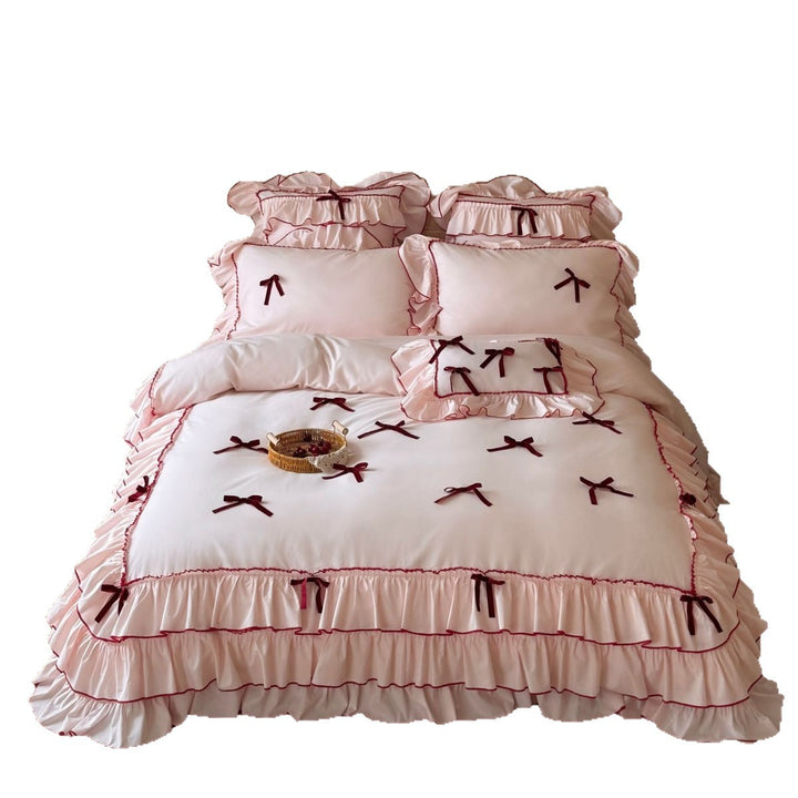 Romantic bedding set with ruffles, frills, and decorative bows