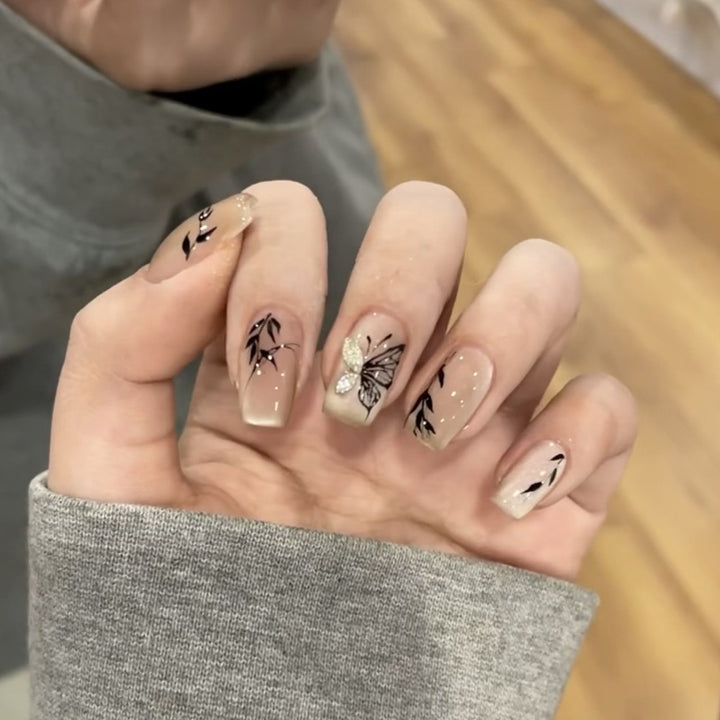 Artificial nail extensions with floral butterfly design Kalsten