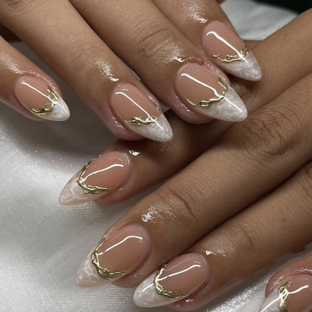 Artful Stiletto Nails with Golden Accents Kalsten