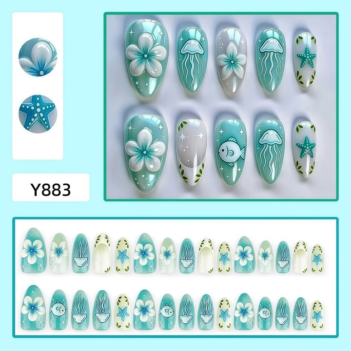 Artificial nails in a maritime design with colorful shell and water motifs Kalsten