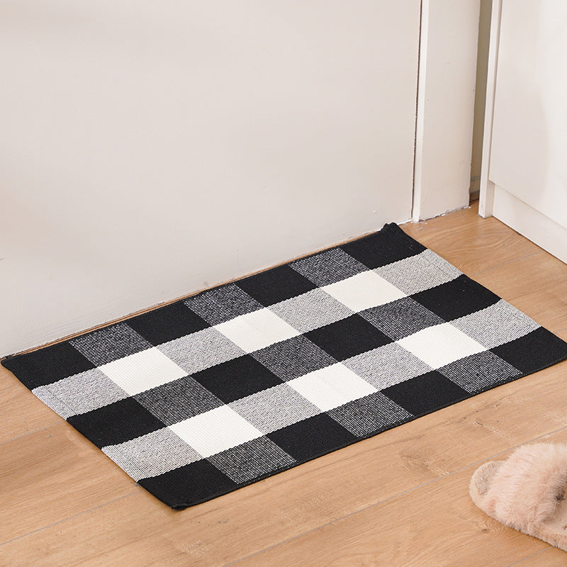 Striped cotton doormat with non-slip bottom and decorative woven edge Kalsten