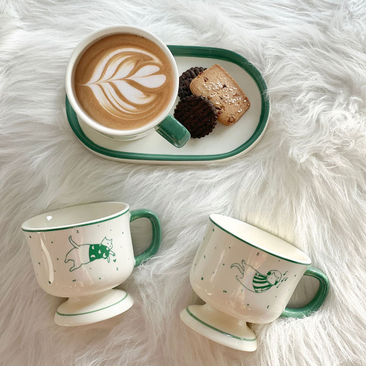 Handcrafted ceramic plate with illustrative cat design
