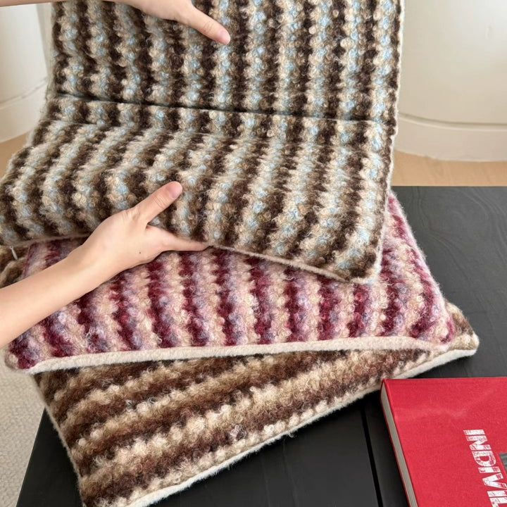Knitted decorative cushion with wool blend and retro stripe texture
